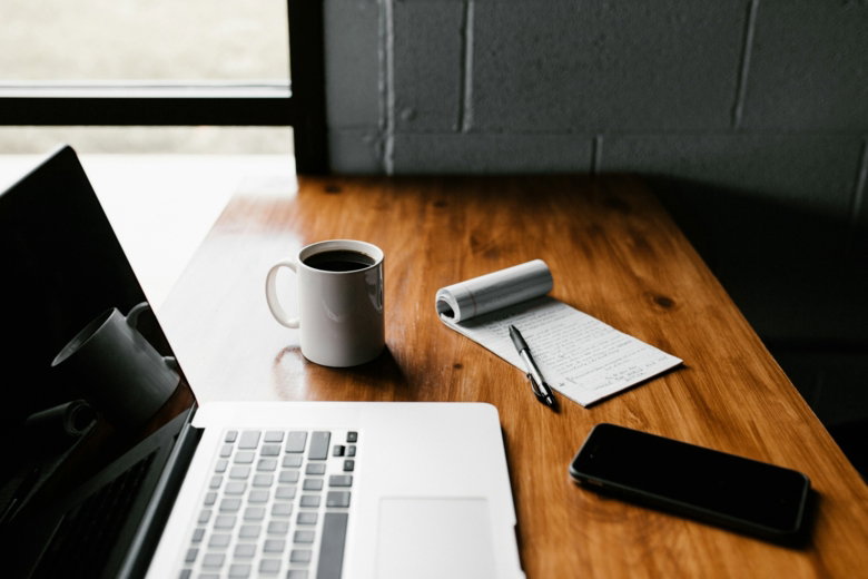 mac-book-pro--white-ceramic-mug-and-black-smartphone-on-table.jpg MacBook Pro, white ceramic mug,and black smartphone on table